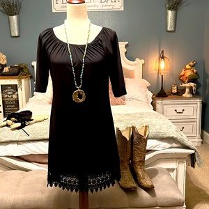 The ultimate black dress.  Lace bottom. In excellent condition. So cute on!